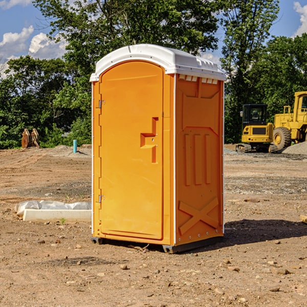 what is the cost difference between standard and deluxe portable restroom rentals in Turton